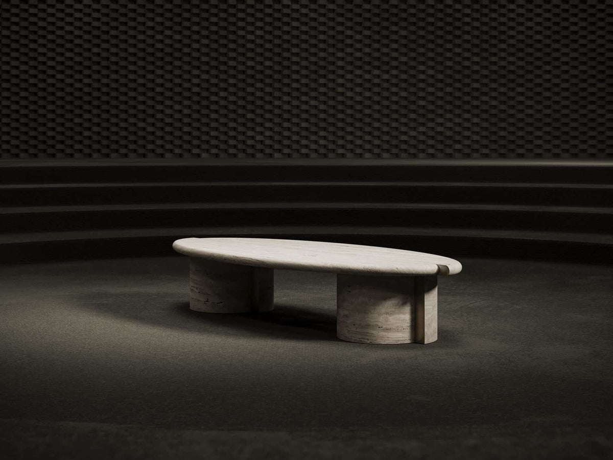 Tayma X Coffee Table in travertine finish in a dark room, wide view