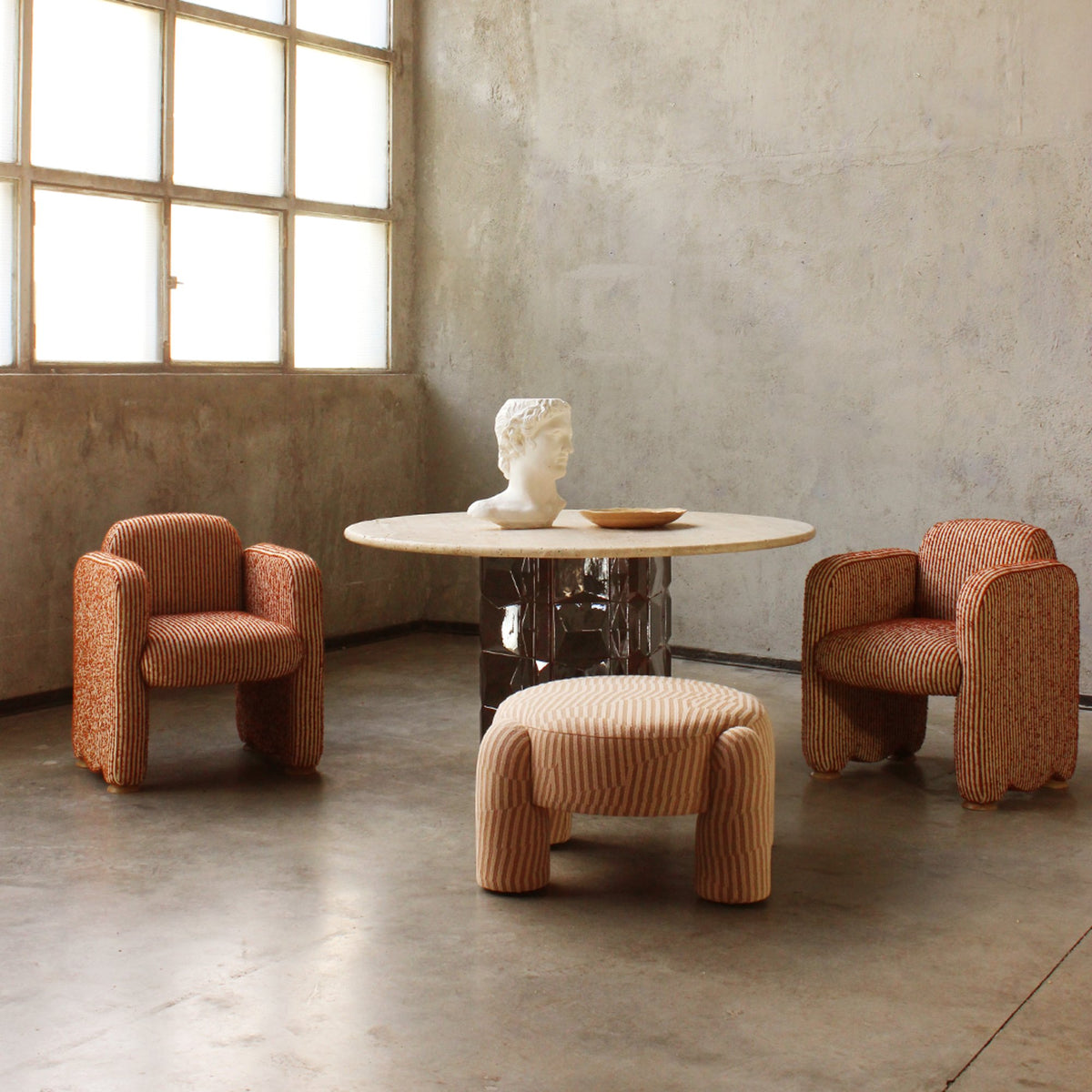 Marlon Pouf in striped weave with matching armchairs and a round table