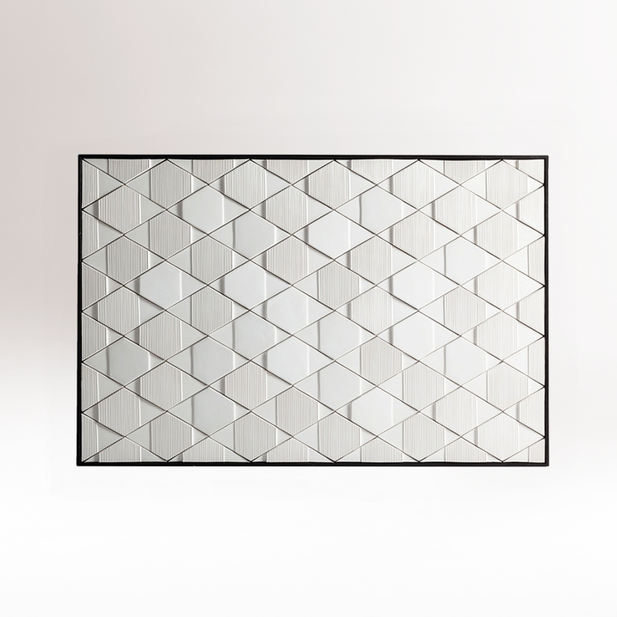 Tua Panel in white relief tiles with black frame, front view