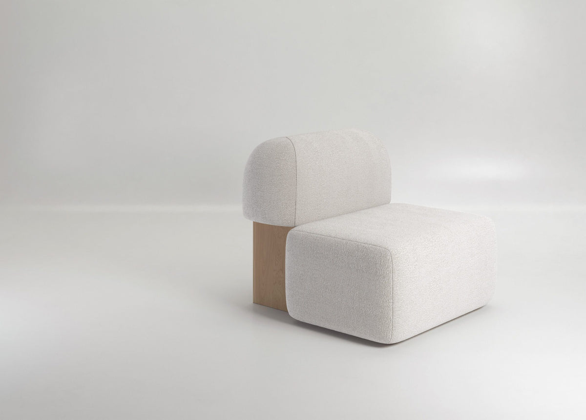 Yemeni Lounge Chair in white boucle, side view showing the oak leg panel