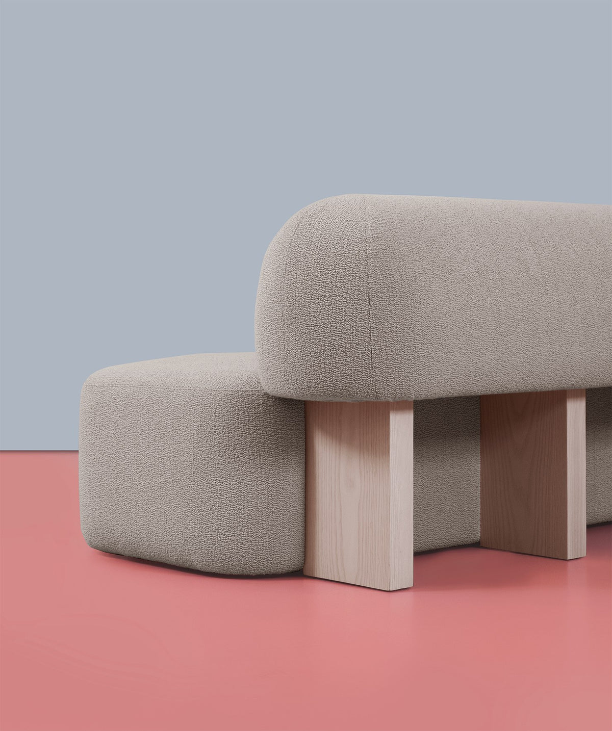 Yemeni Sofa in grey Soft Bouclé, angled close view of the wood supports