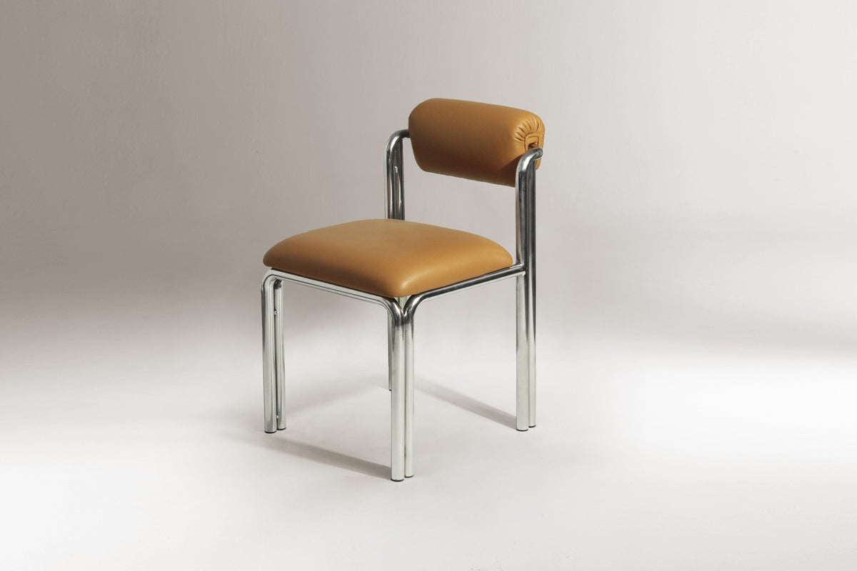 Cubu chair in tan leather on a polished nickel frame