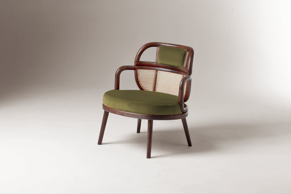 Havana Armchair in green velvet with cane back, three-quarter view