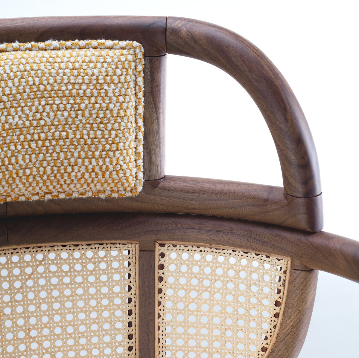 Havana Armchair close-up of woven backrest, curved wood arm and cane