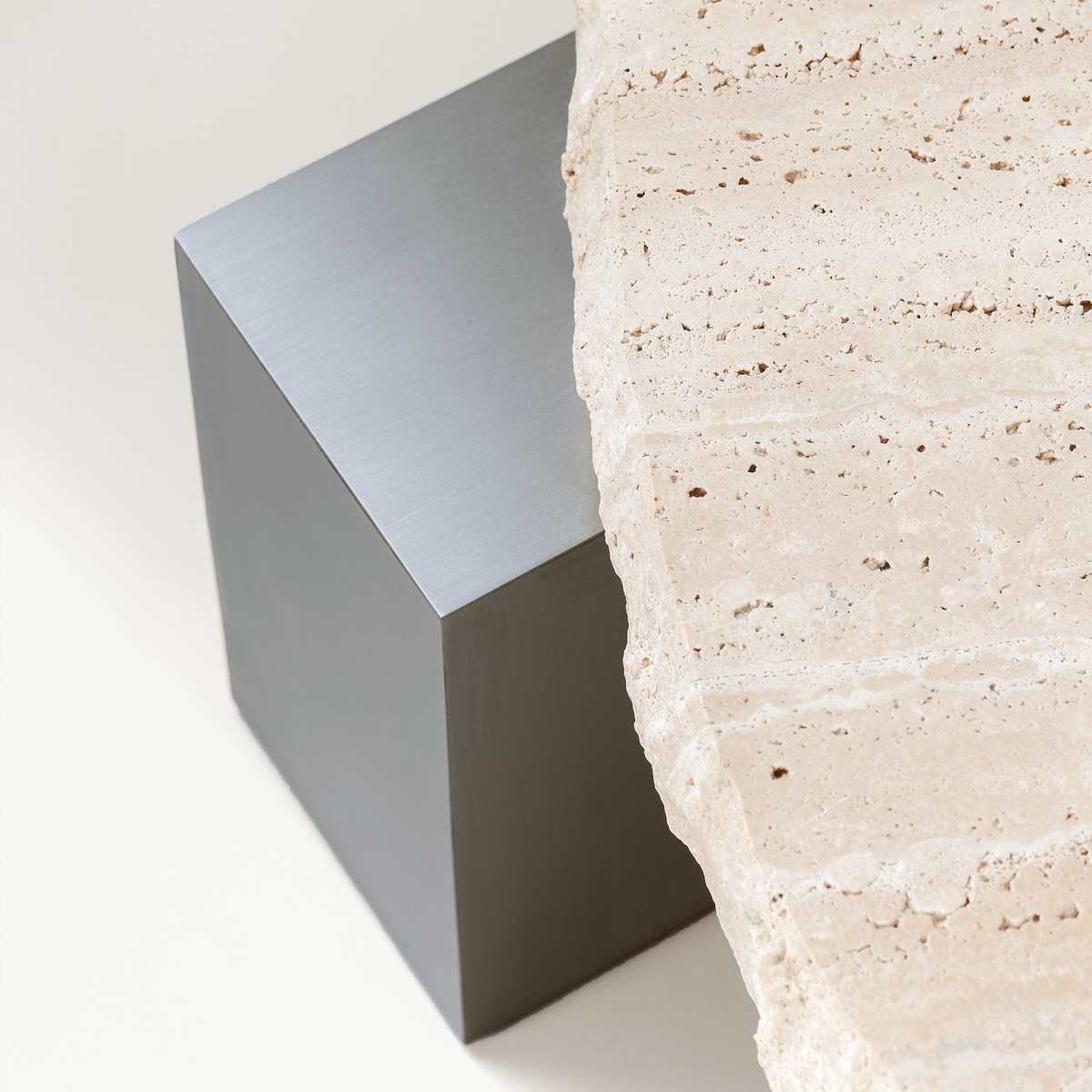 On The Rocks Side Table detail of the Travertine top on a Satin Nickel base