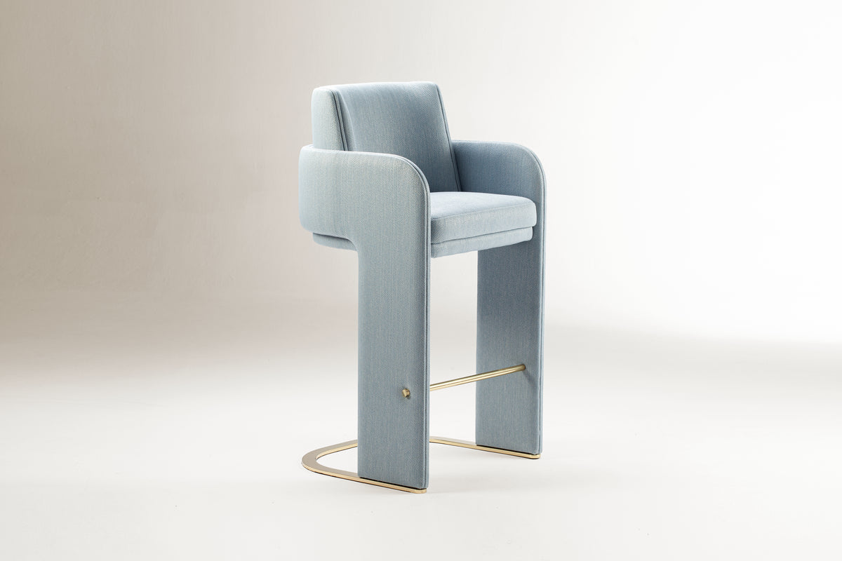 Odisseia Counter Stool in pale blue on a soft grey backdrop