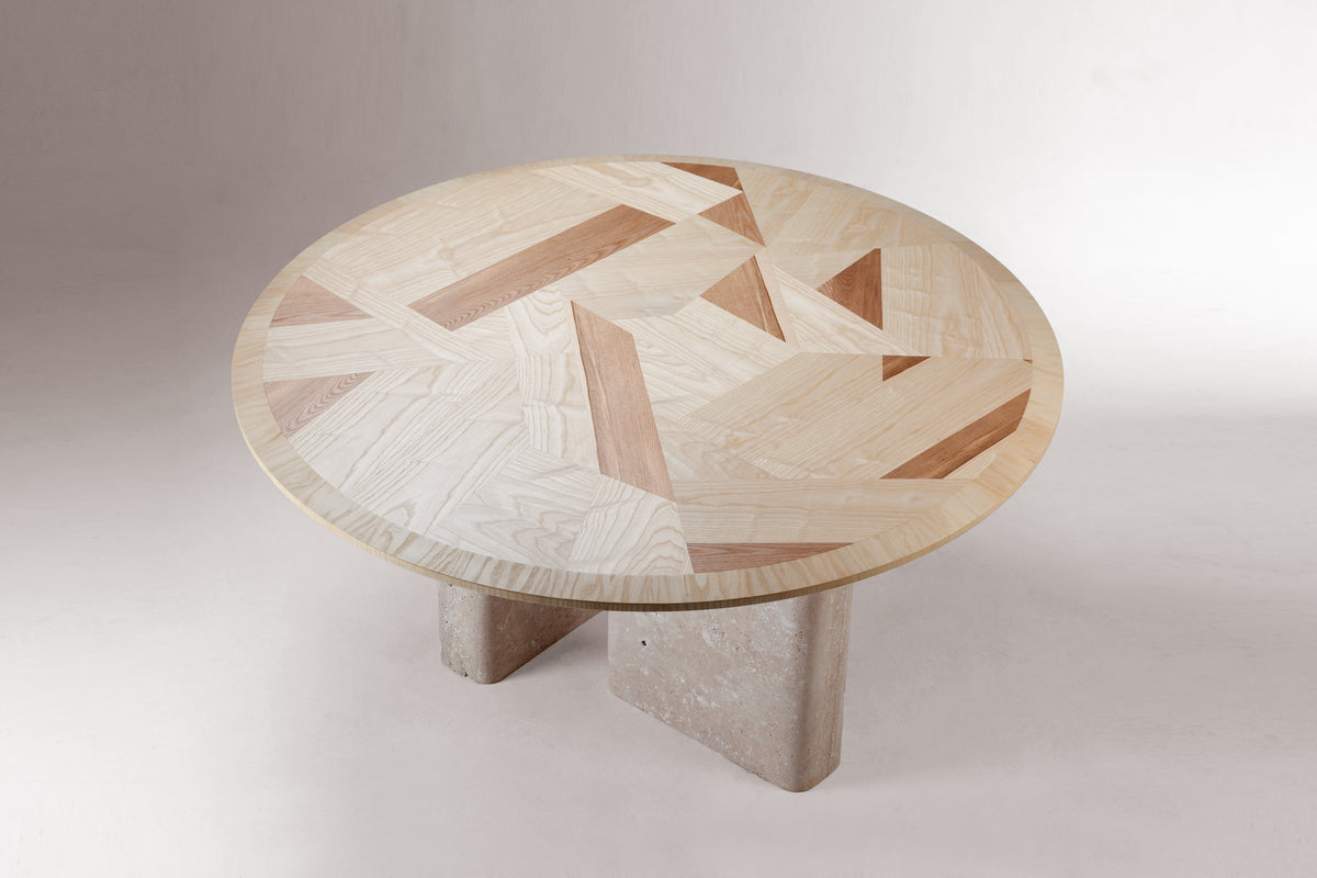 L 'Anamour Dining Table three-quarter view of geometric marquetry top