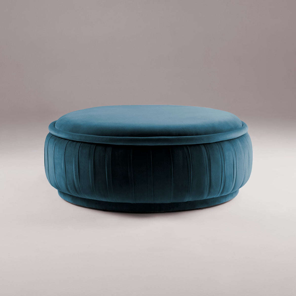 Malibu Ottoman in teal velvet with pleated sides, front view