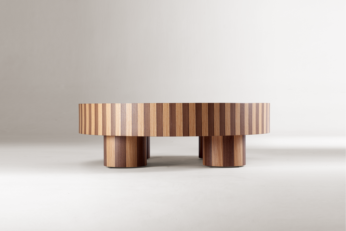 Nusa Coffee Table in striped two-tone wood on a grey backdrop