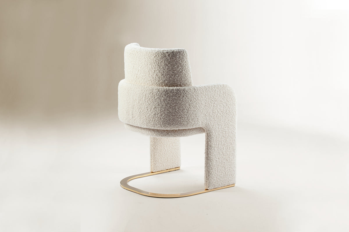 Odisseia Dining Chair in ivory bouclé, rear view on a soft studio backdrop