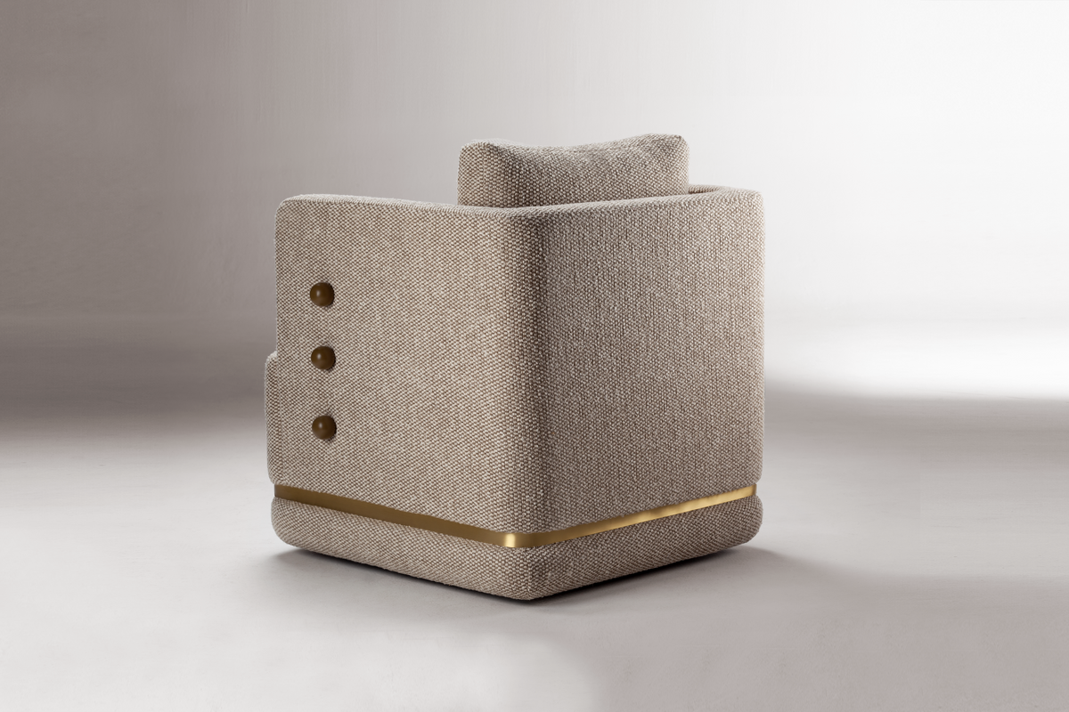 Panorama Armchair in beige weave, rear three-quarter view showing brass band