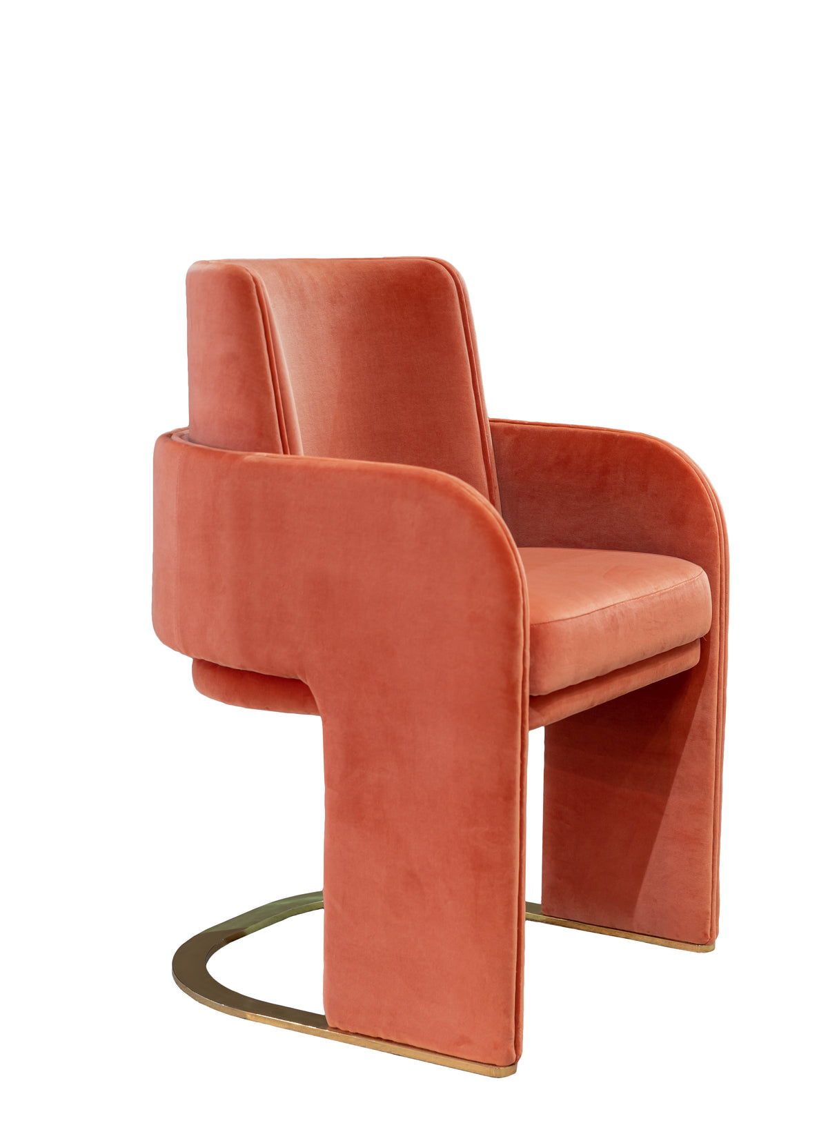 Odisseia Dining Chair in coral velvet, close three-quarter view of the sculpted arms