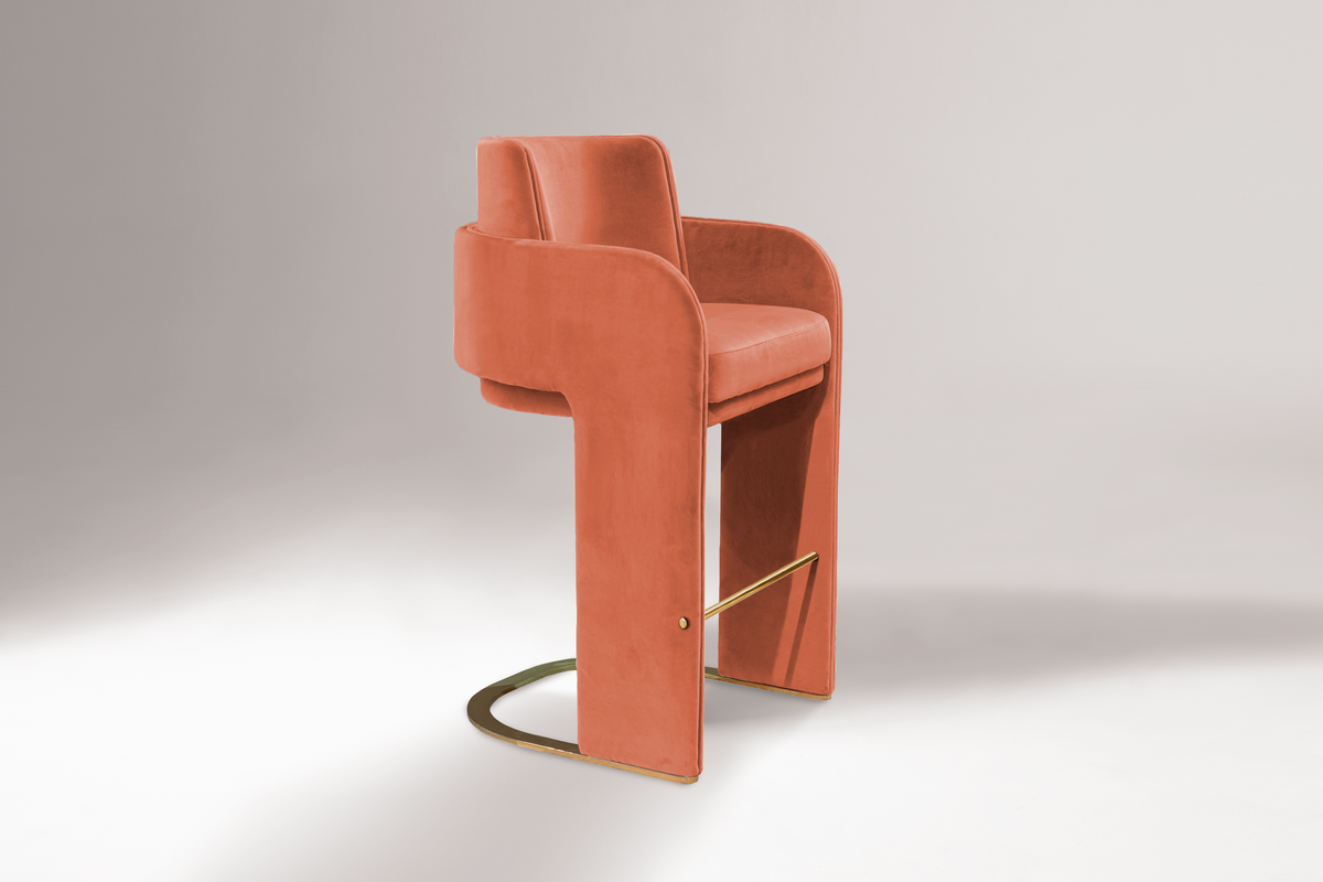 Odisseia Counter Stool in coral velvet on a soft grey backdrop
