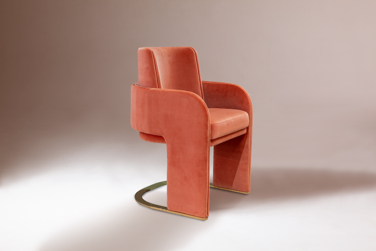 Odisseia Dining Chair in coral orange velvet, three-quarter view