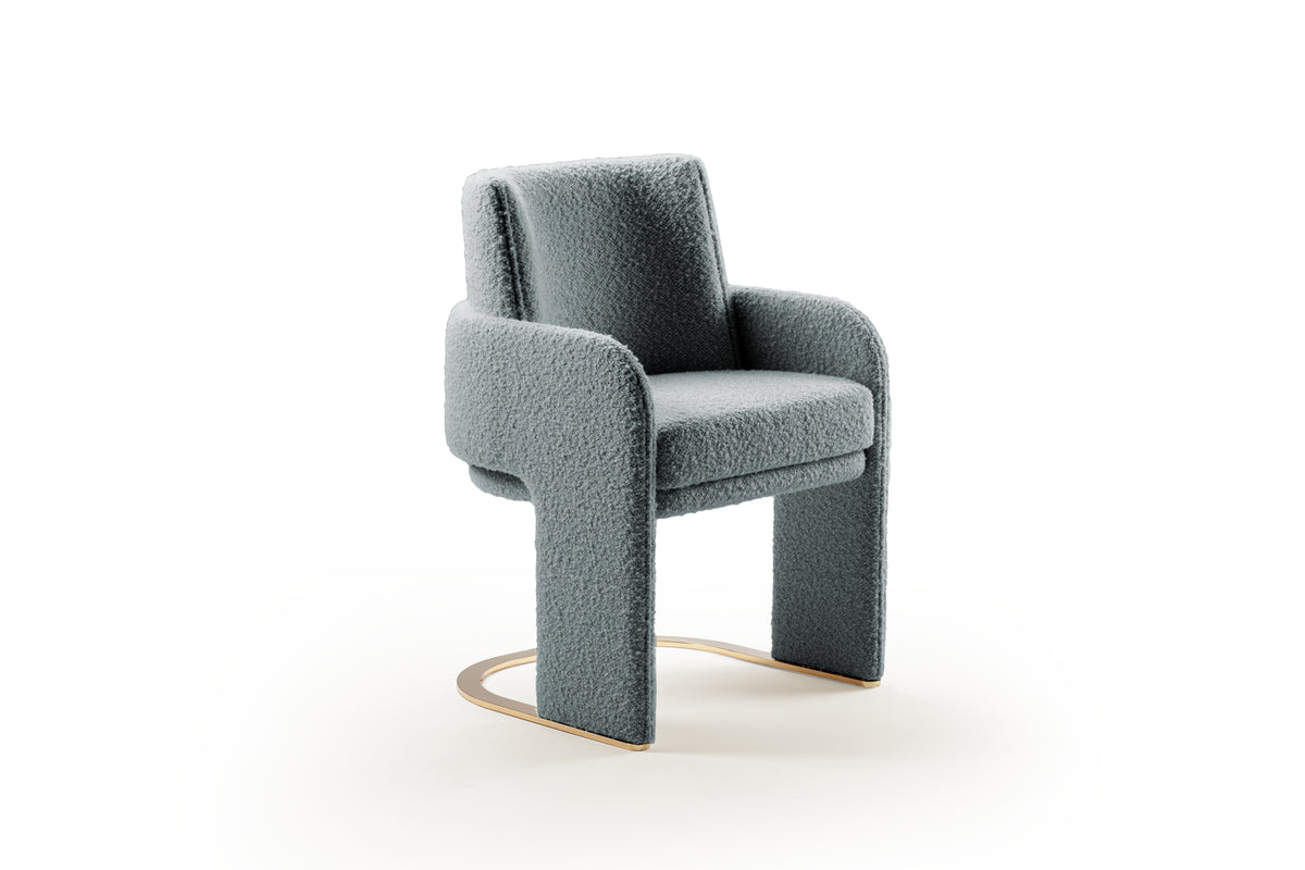 Odisseia Dining Chair in blue-grey bouclé, three-quarter view on white