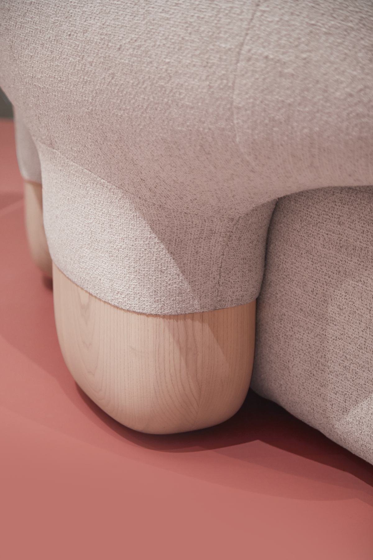 Asawa Sofa close-up of wooden foot on a pink floor