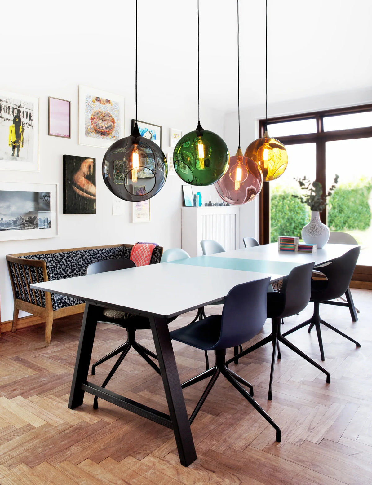 Contemporary Dining Area Featuring Four Ballroom XL Smoke, Green, Pink, and Amber Glass Pendant Lamps