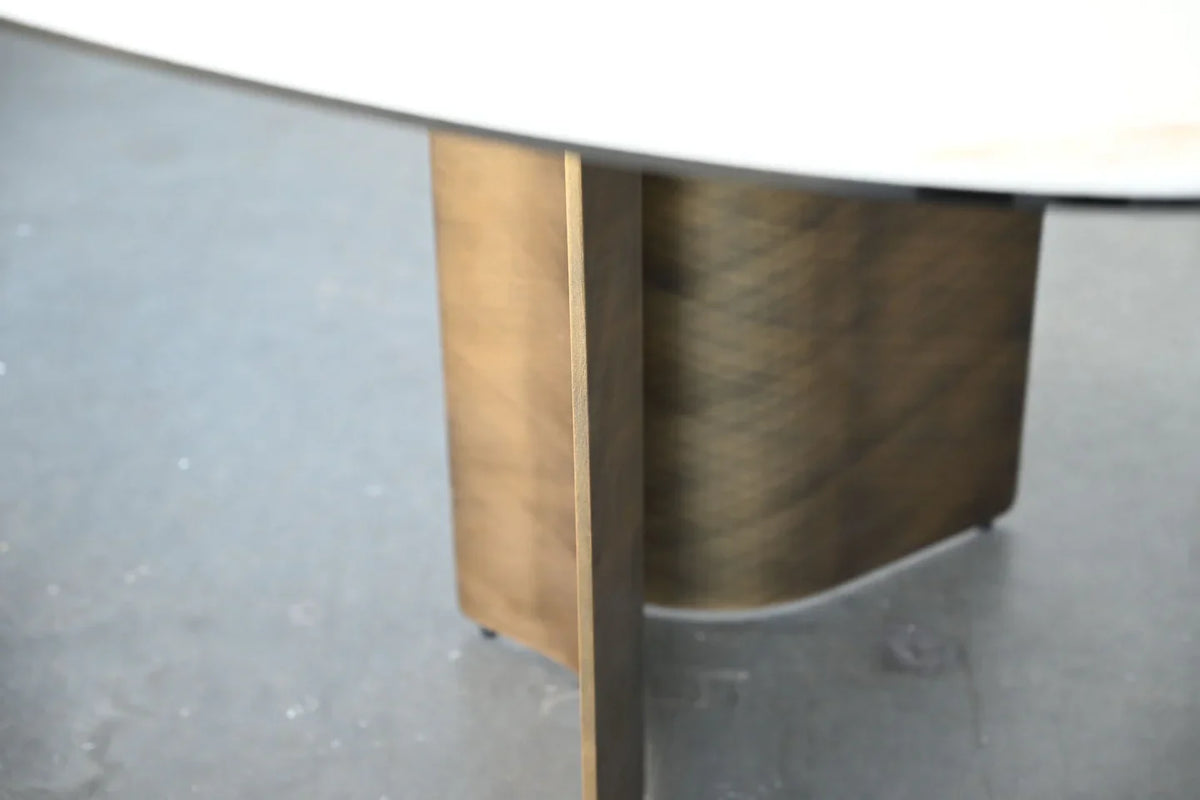 Sorrento Dining Table close-up of the bronze-tone curved leg