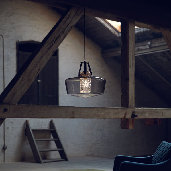 Addicted To Us Pendant Light Black with smoked glass shade hanging in a timber-beamed attic