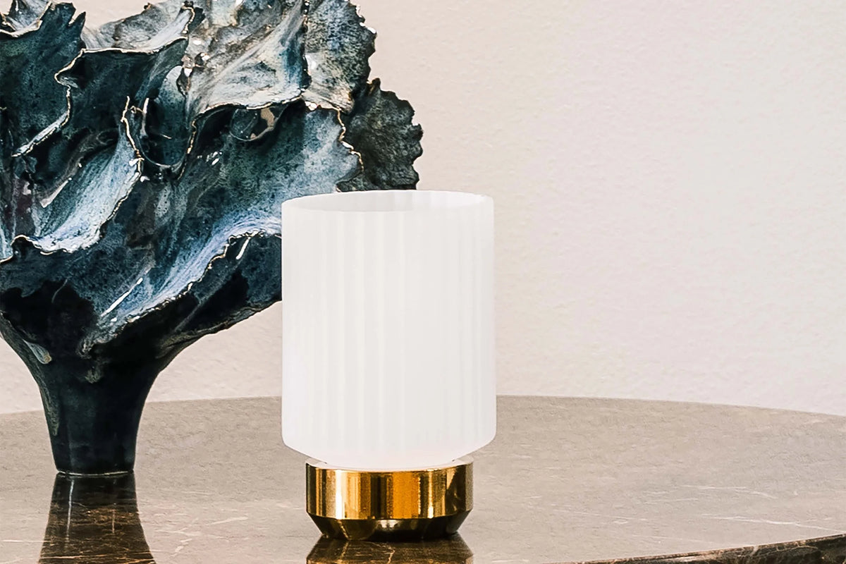 Sons of Brass Candle Holder hurricane in Opal glass on a marble table