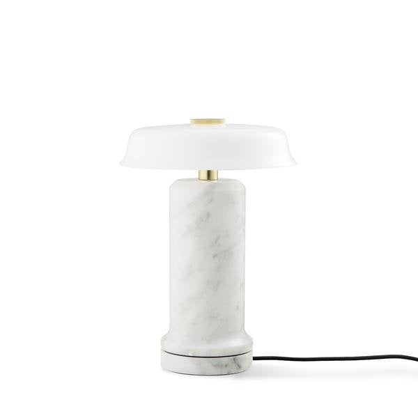Trip 2 Table Lamp in Carrara / Opal on its white marble charging base with cord