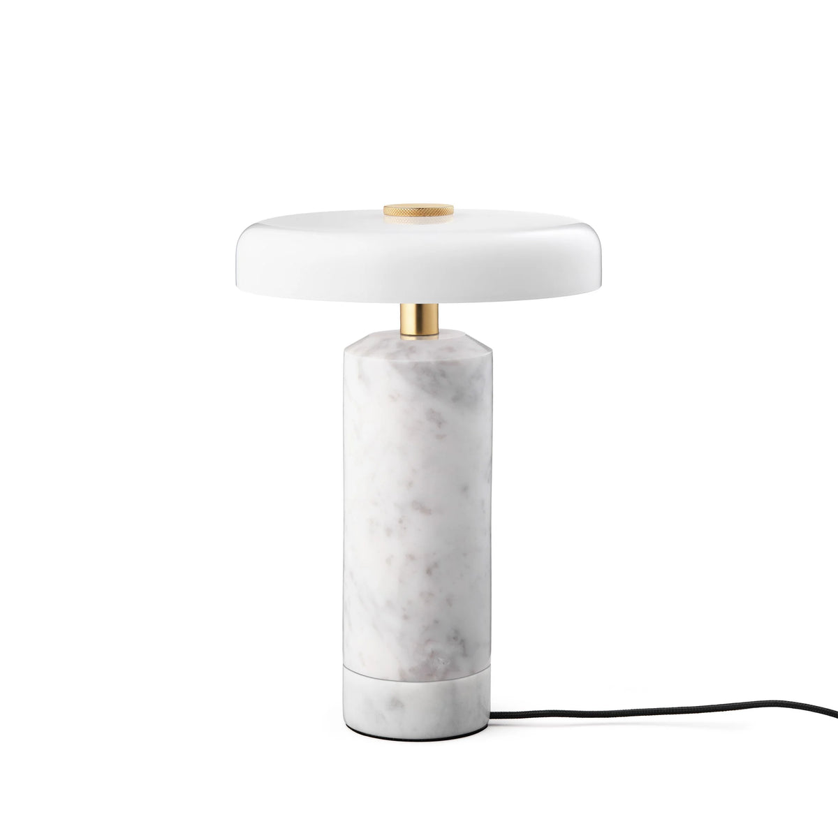 Trip Table Lamp in Carrara / Opal on its charging base with cable