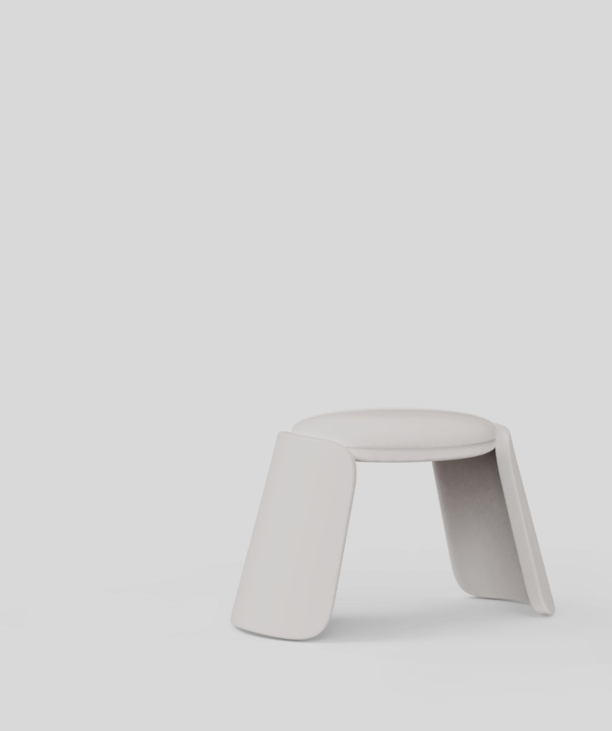 Inge Pouf in light grey on a pale grey backdrop