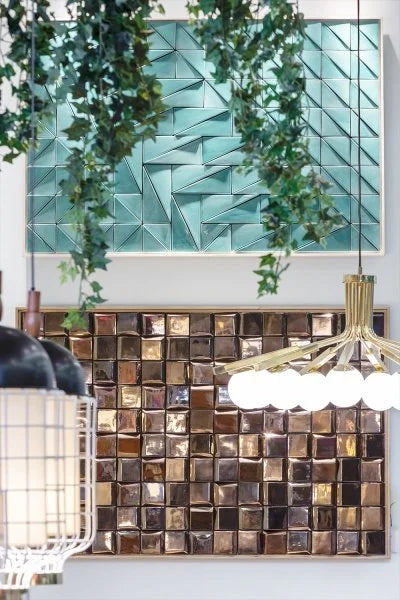 Douro Panel in Gold below a teal tile panel with hanging plants