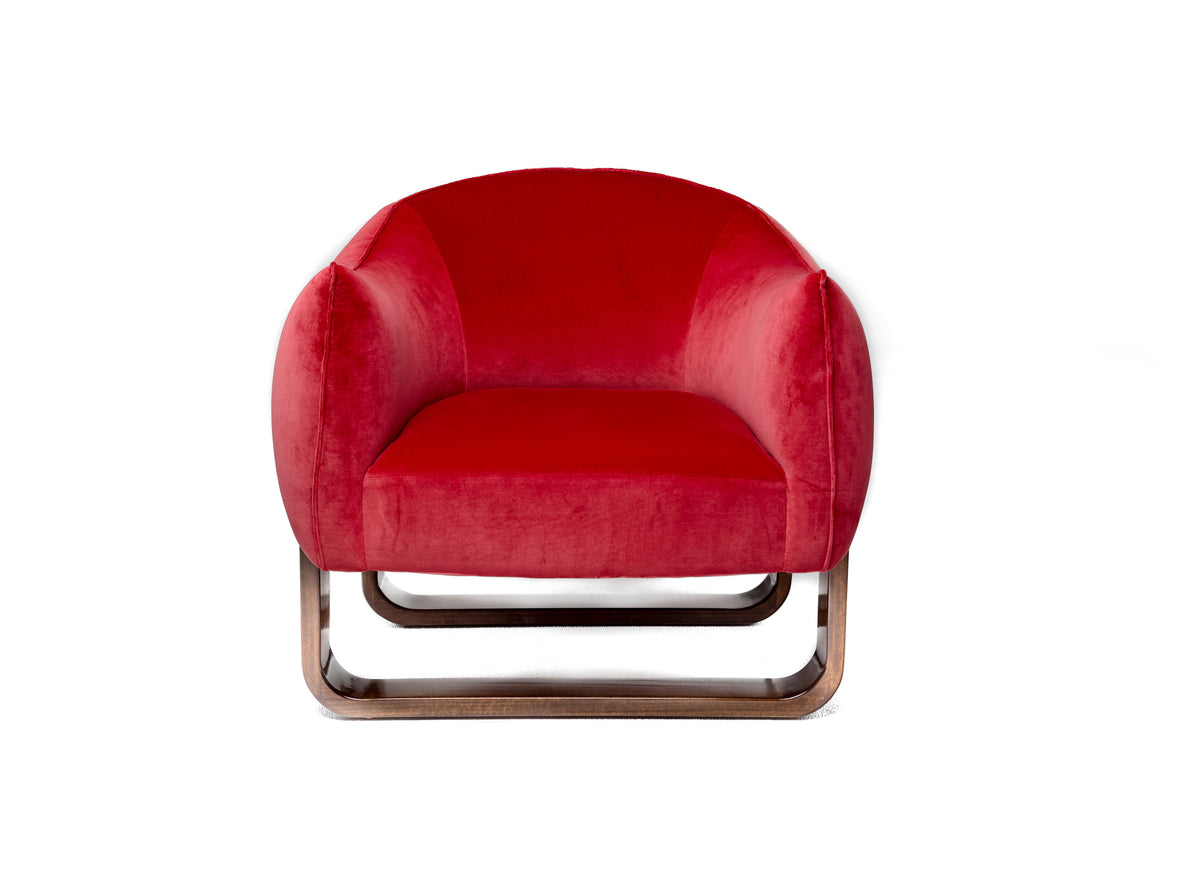 Milo Armchair in red velvet with rounded back and copper-tone sled base, front view