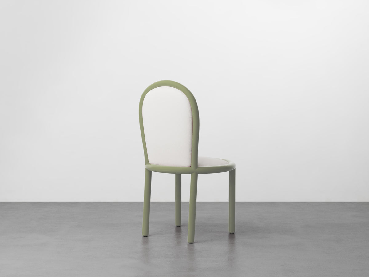 Masa Dining Chair with sage green frame, front view on concrete