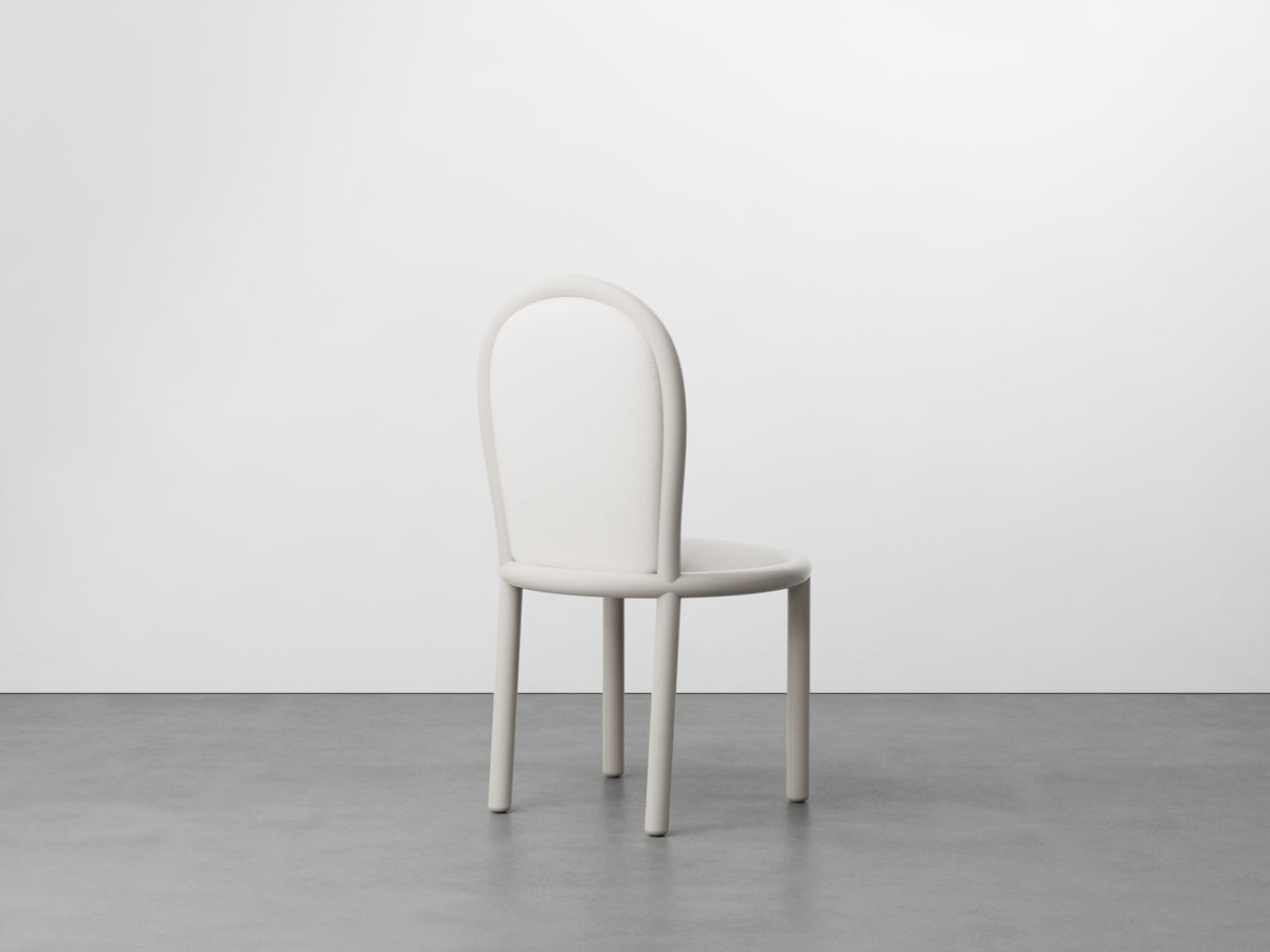 Masa Dining Chair with ivory frame, front view on concrete floor
