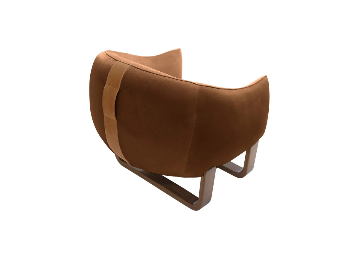 Milo Armchair back view in Terra Cotta Chesterfield velvet with leather handle