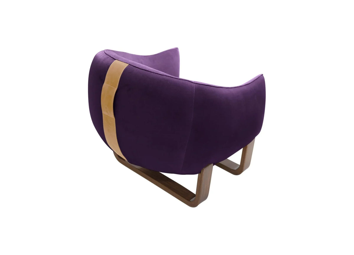 Milo Armchair back view in purple velvet with tan leather strap and sled base