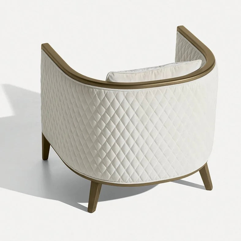 Saten Armchair in quilted white with bronze-tone frame, rear three-quarter view