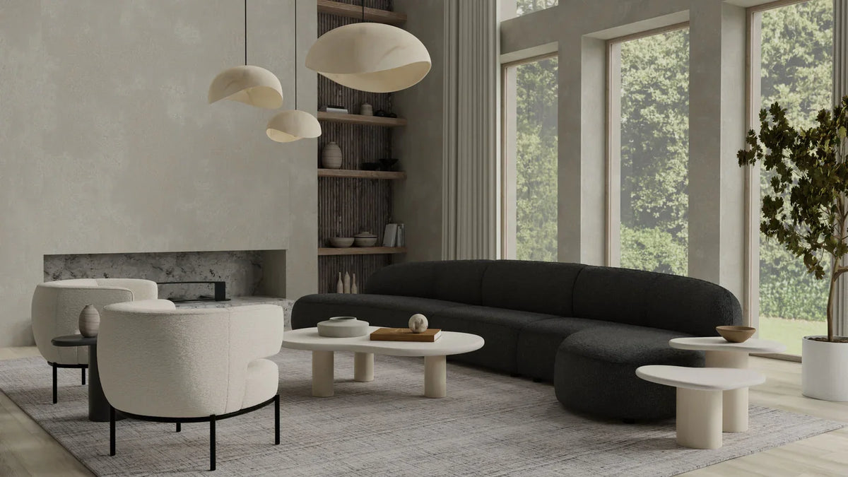 Moritz 3-Piece Sectional in Licorice Boucle in a bright living room with white armchairs