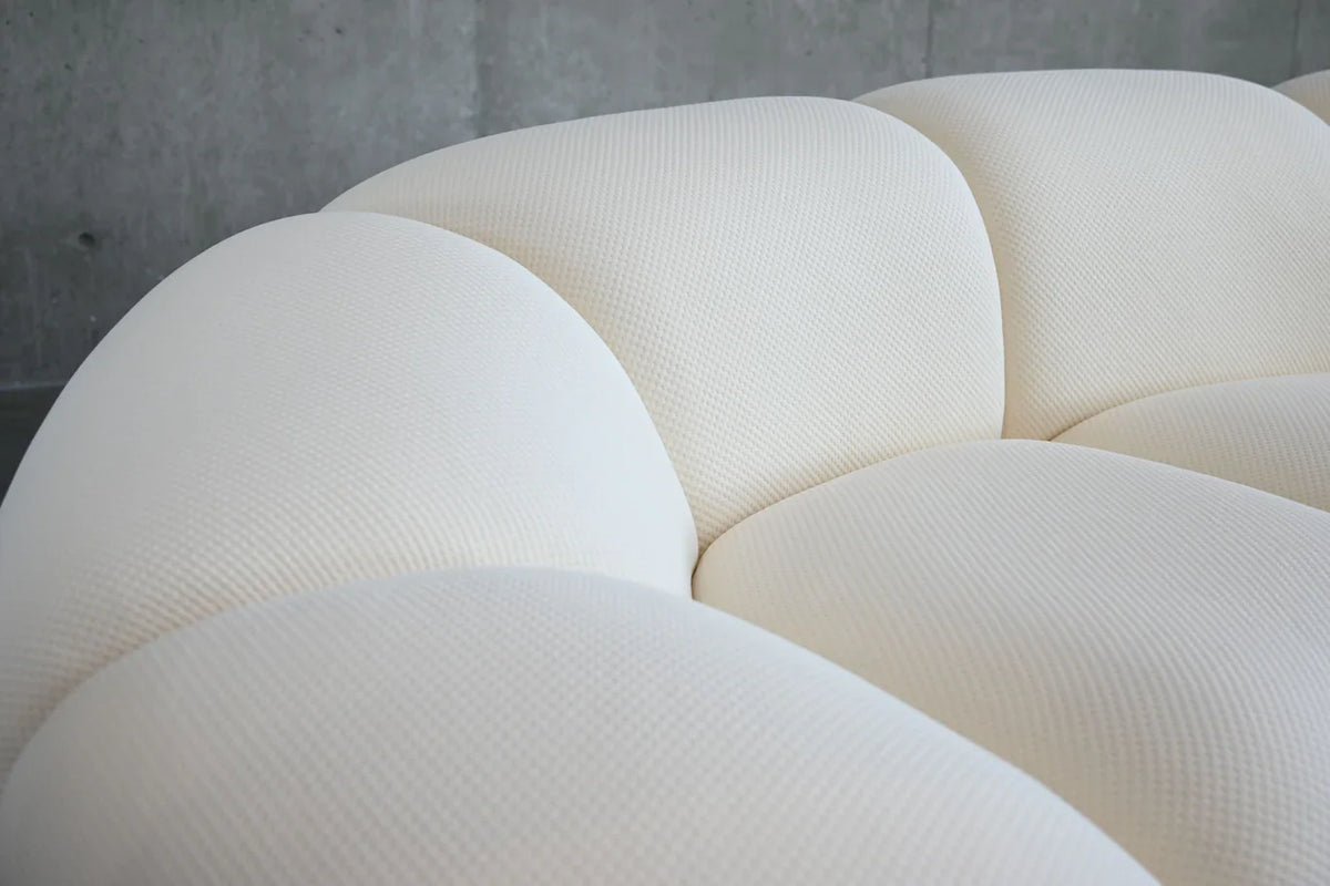 Cirro Sofa in Buttermilk, detail of rounded arm and back channels
