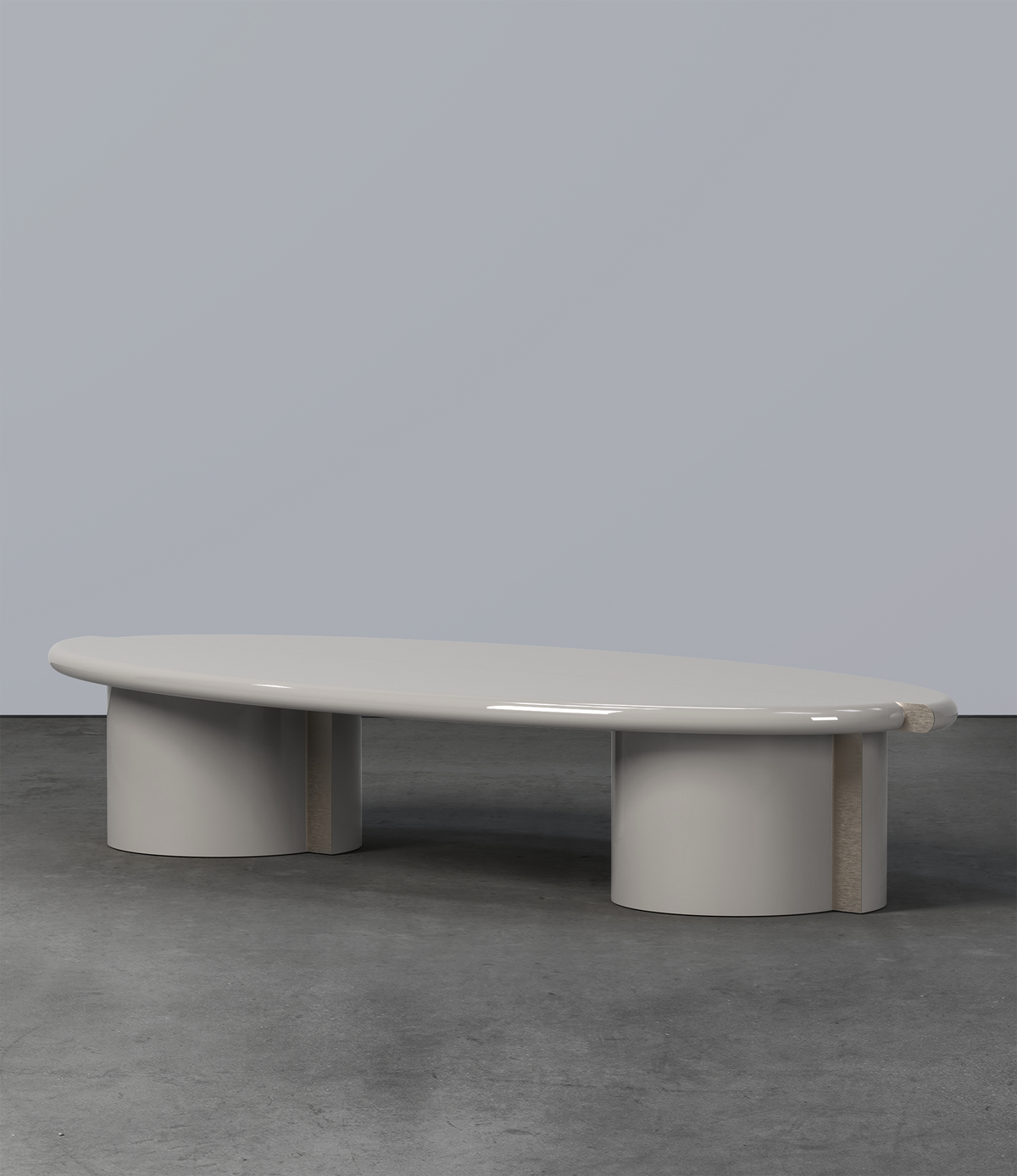 Tayma Coffee Table in grey lacquer on a concrete floor, side view