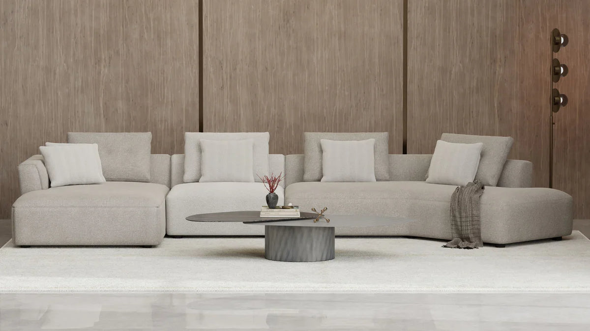 Layer Coffee Table in a living room with a grey sectional sofa