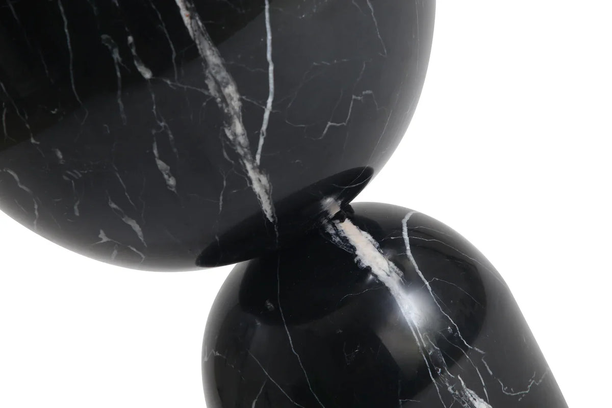 Apothecary End Table in Black Marble close-up of the curved joint and white veining