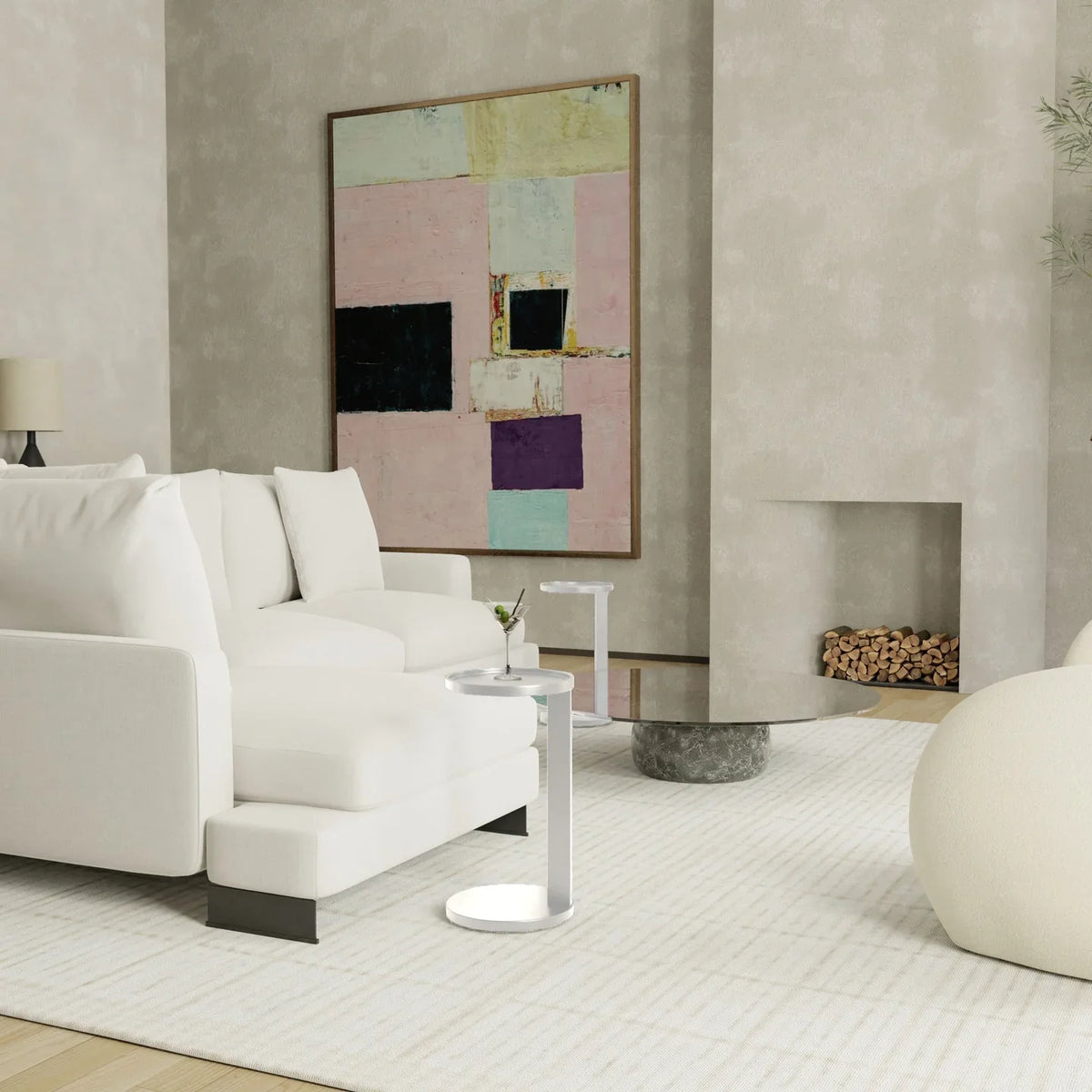 Rookie End Table in Matte White beside a white sofa in a neutral living room