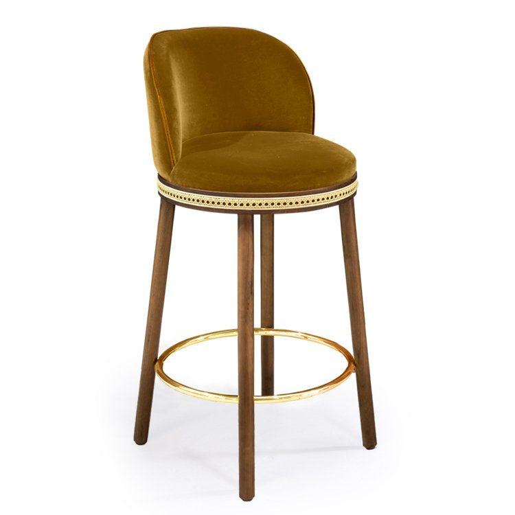 Alma Counter Stool in Dijon velvet with natural walnut legs and polished brass footrest