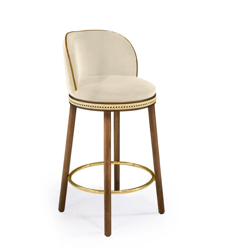 Alma Counter Stool in Nuage velvet with natural walnut legs and satin brass footrest
