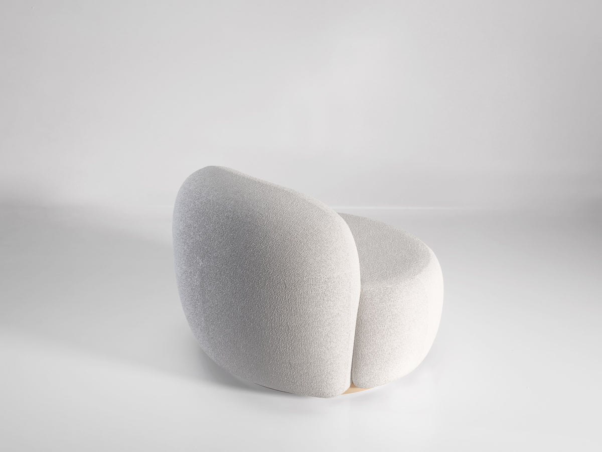 B-15 Z Lounge Chair in white bouclé, side profile on a grey backdrop