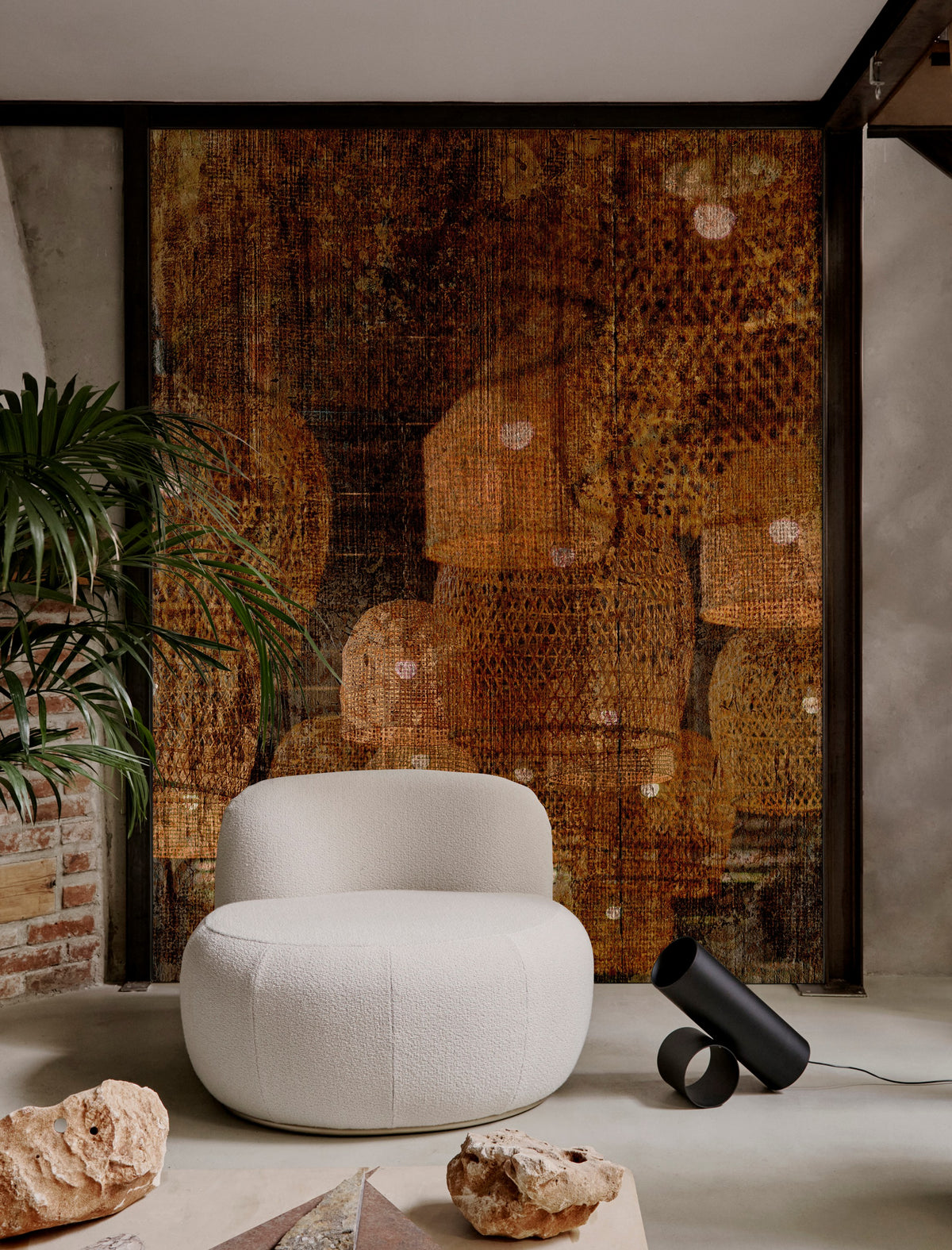 B-15 Z Lounge Chair in off-white bouclé before a rust tapestry with stones and a black lamp