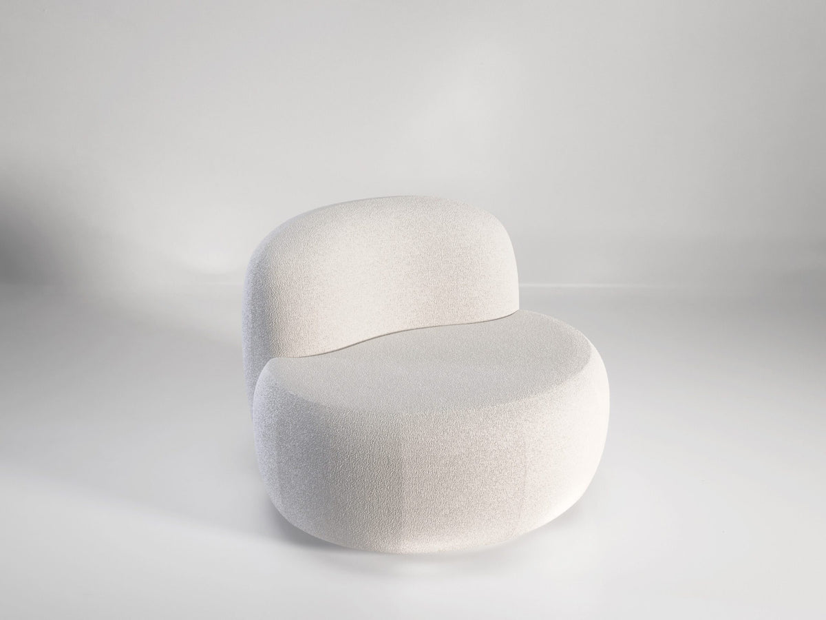 B-15 Z Lounge Chair in white bouclé, three-quarter side view in a grey studio