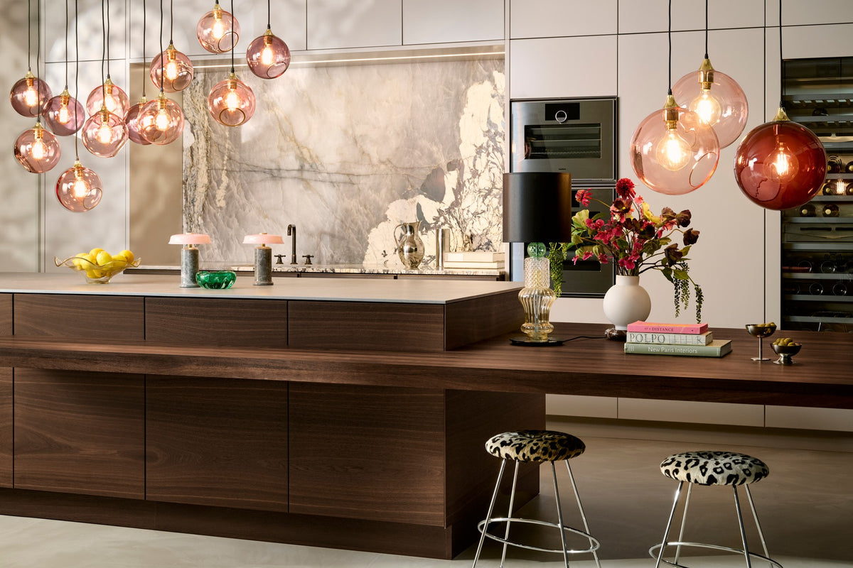 Ballroom Pendant Lights over a kitchen island by Maison Burgos