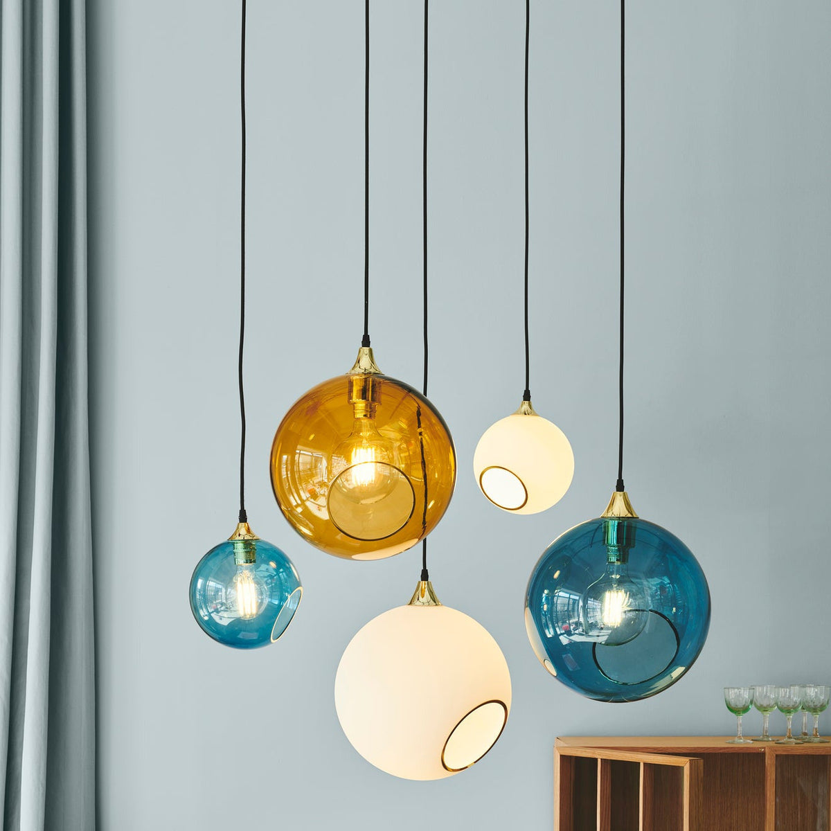 Ballroom Blue Pendant Light among amber, blue and opal glass pendants