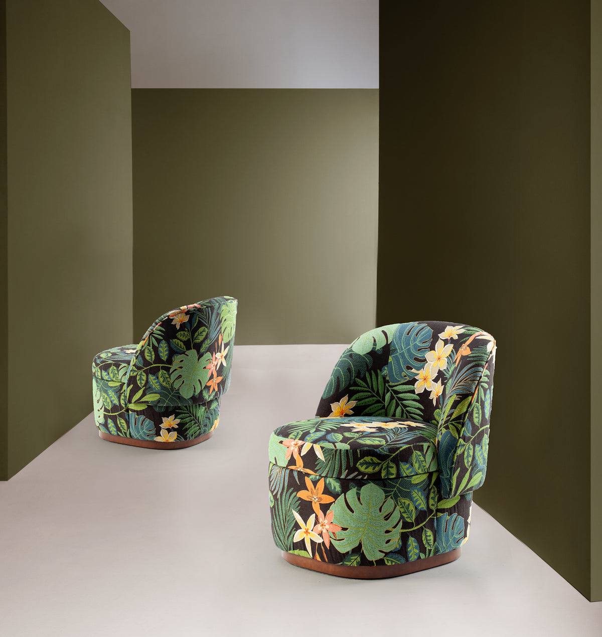 Bisou Armchair pair in tropical leaf print in an olive-green room