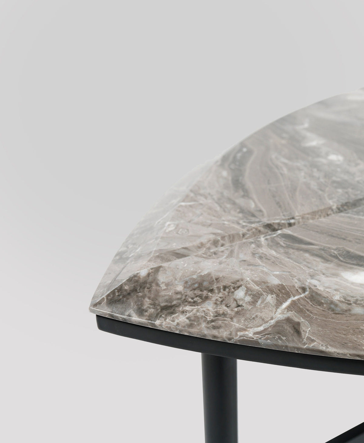 Book One & Two Coffee Table close-up of the marble edge and black leg