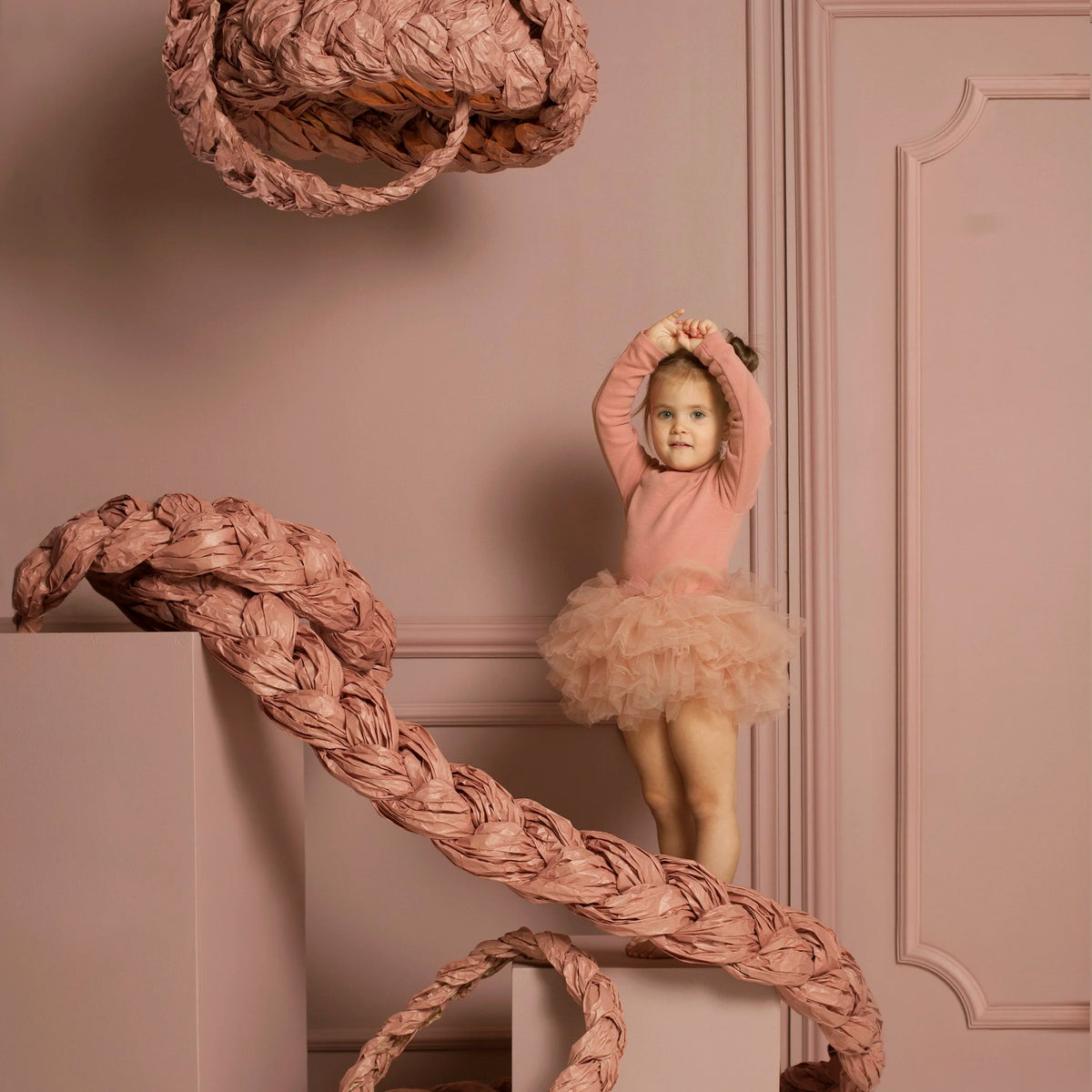 Mammalampa Bride Pendant Light Pink above a girl in a pink tutu in a pink panelled room
